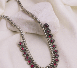Arvana traditional necklace with ruby-toned accents